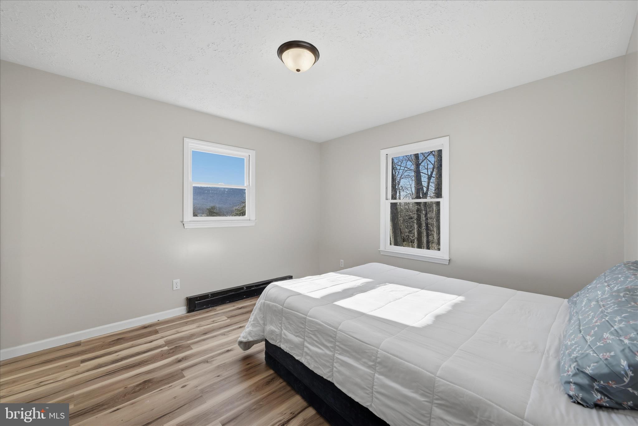 2280 Pine Grove Road Berkeley Springs, WV 25411 - Photo 23 of 59 a bedroom with a bed and a window