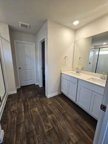 an empty room with a window and windows