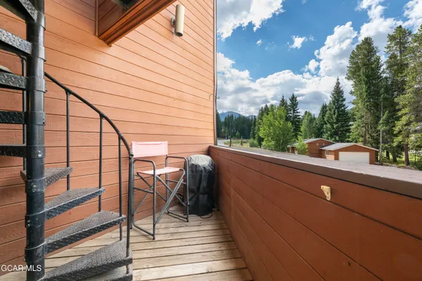 a view of balcony with furniture