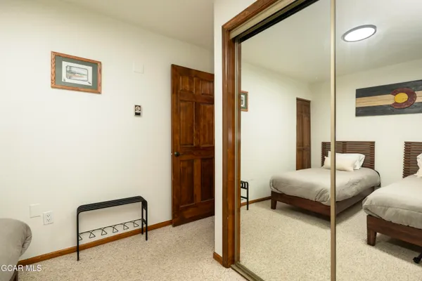 a bedroom with furniture and a window