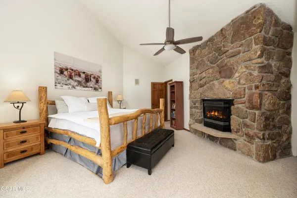a bed room with a bed and a fireplace