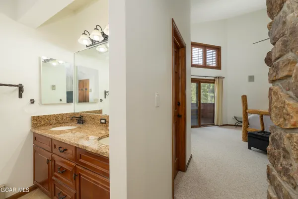 a bath tub sitting next to a white sink