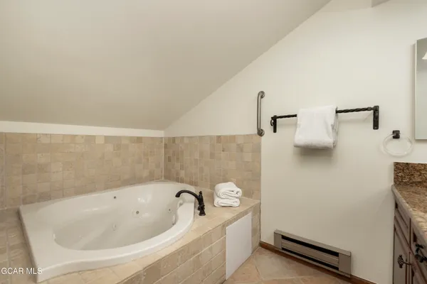 a bathroom with a shower and toilet