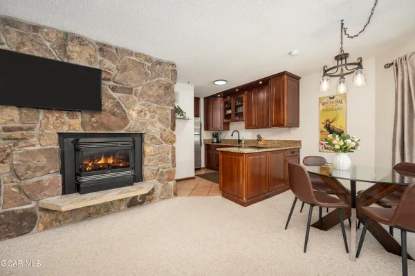 a kitchen with a cabinets and a fireplace