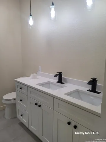 a bathroom with a shower and a bath tub