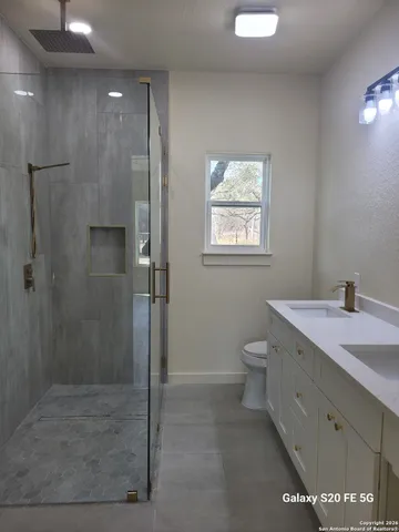 a bathroom with a toilet and a sink