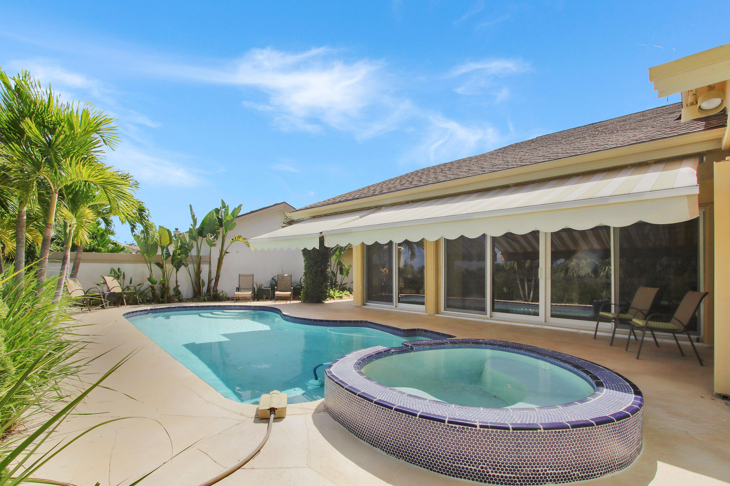 317 Ridge Road Jupiter, FL 33477 - Photo 27 of 33 Extended Awnings for additional shade