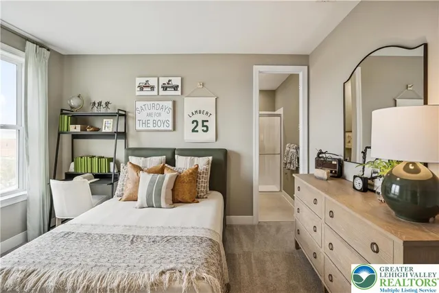 a bedroom with a bed and a dresser