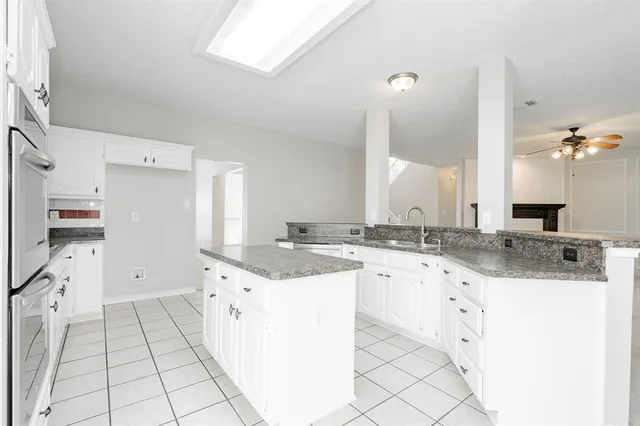 a kitchen with a sink and cabinets