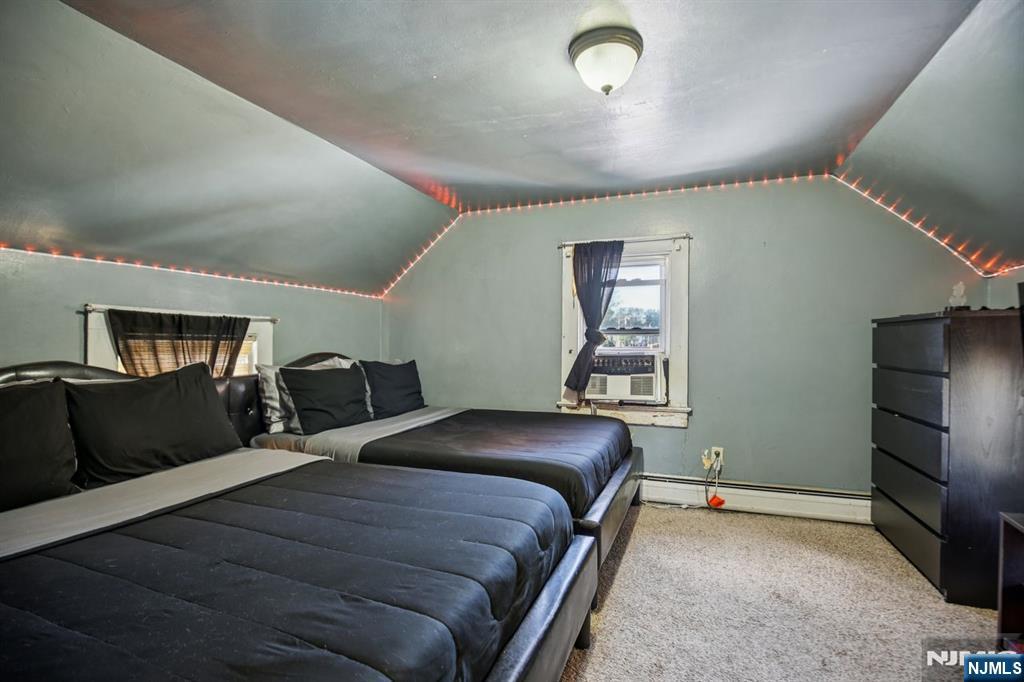 369 Queens Court Ridgewood, NJ 07450 - Photo 15 of 40 a bedroom with a bed and wooden floor