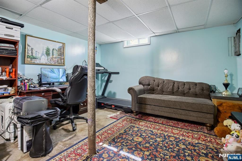 369 Queens Court Ridgewood, NJ 07450 - Photo 17 of 40 a living room with furniture and a rug