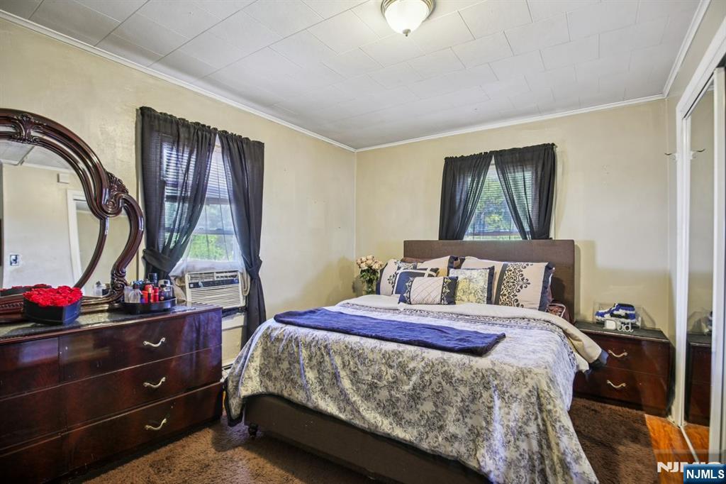 369 Queens Court Ridgewood, NJ 07450 - Photo 19 of 40 a bedroom with a bed and a dresser