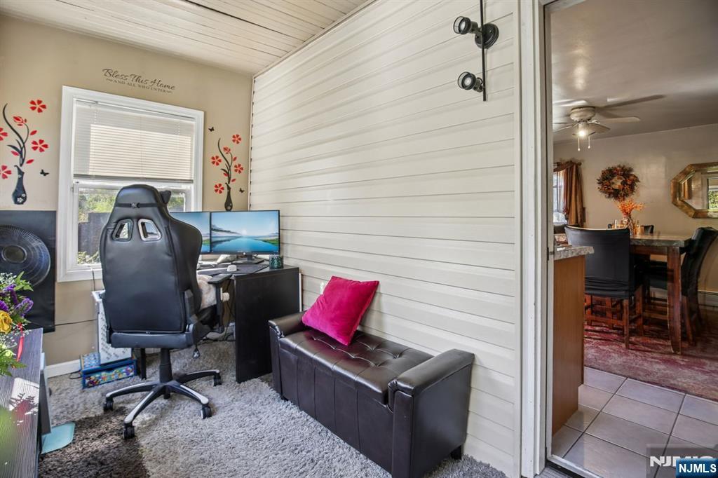 369 Queens Court Ridgewood, NJ 07450 - Photo 22 of 40 a view of a workspace with furniture and a window