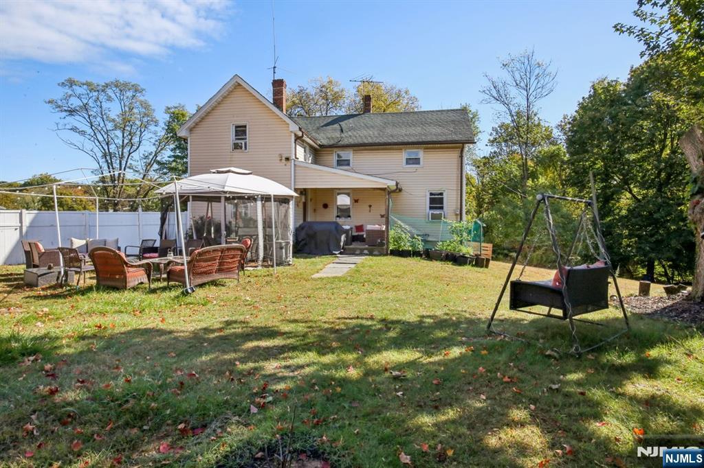 369 Queens Court Ridgewood, NJ 07450 - Photo 30 of 40 a view of a house with backyard porch and sitting area