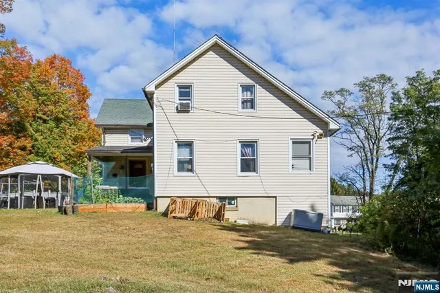 a view of a house with a tree
