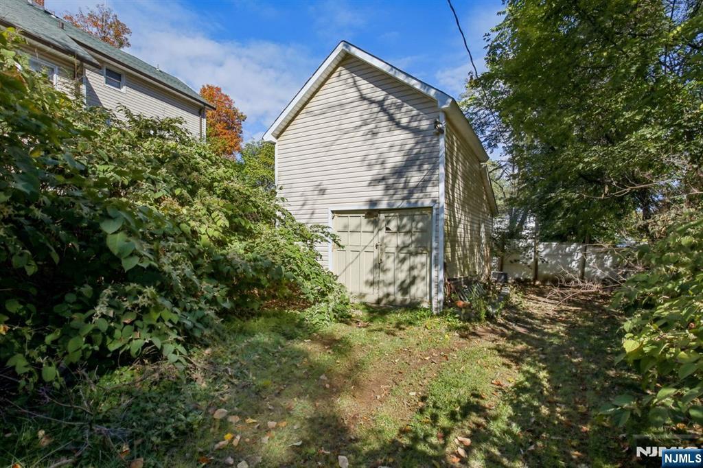 369 Queens Court Ridgewood, NJ 07450 - Photo 35 of 40 a view of a house with a tree