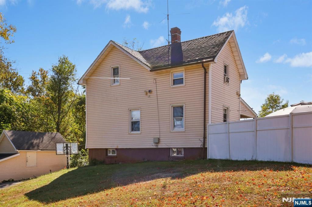369 Queens Court Ridgewood, NJ 07450 - Photo 37 of 40 a front view of a house with a yard