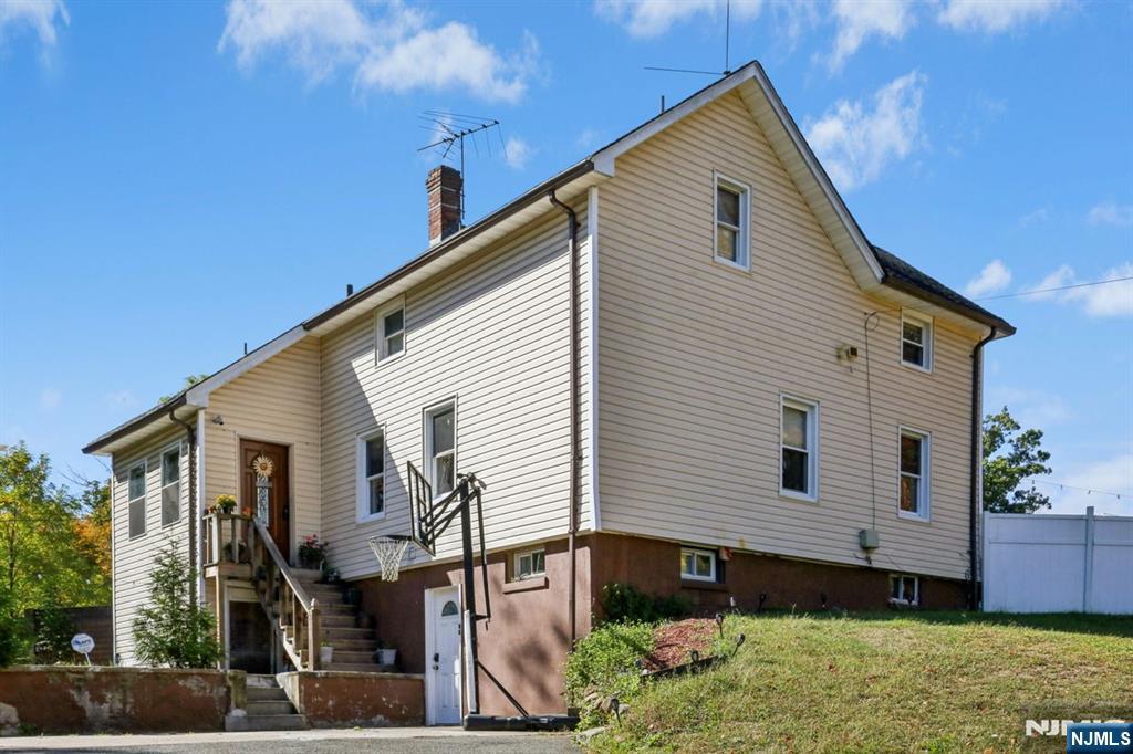 369 Queens Court Ridgewood, NJ 07450 - Photo 40 of 40 a front view of a house with a yard