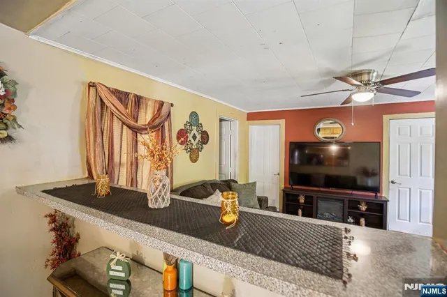 a bedroom with bed and a chandelier