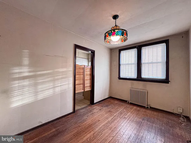 a view of an entryway with wooden floor