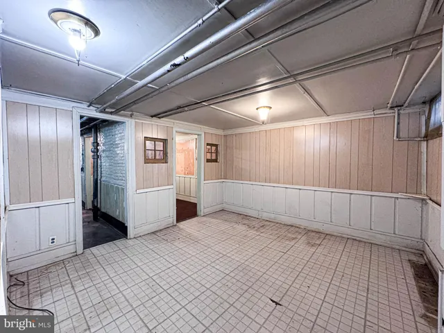 a view of a hallway with closet and racks