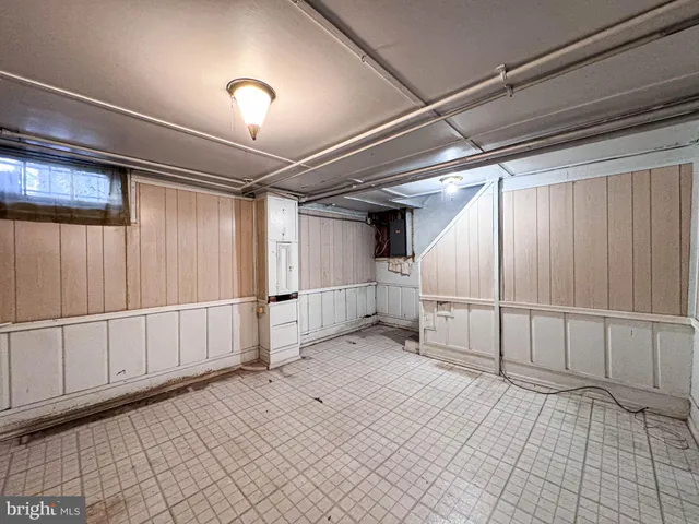 a view of an entryway with wooden wall