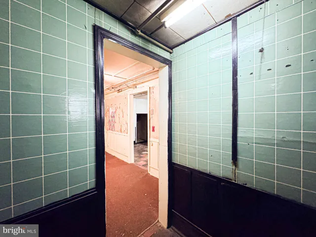 a view of an empty room with windows