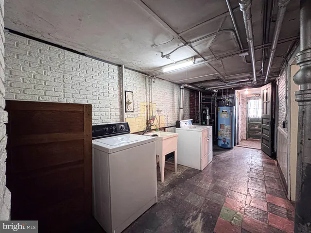 a view of a storage & utility room with washer and dryer