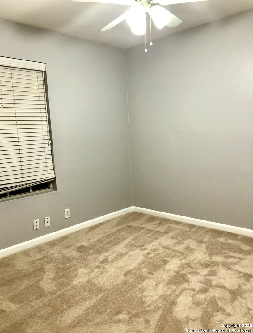 9135 Rue De Lis San Antonio, TX 78250 - Photo 18 of 23 a view of an empty room with a window