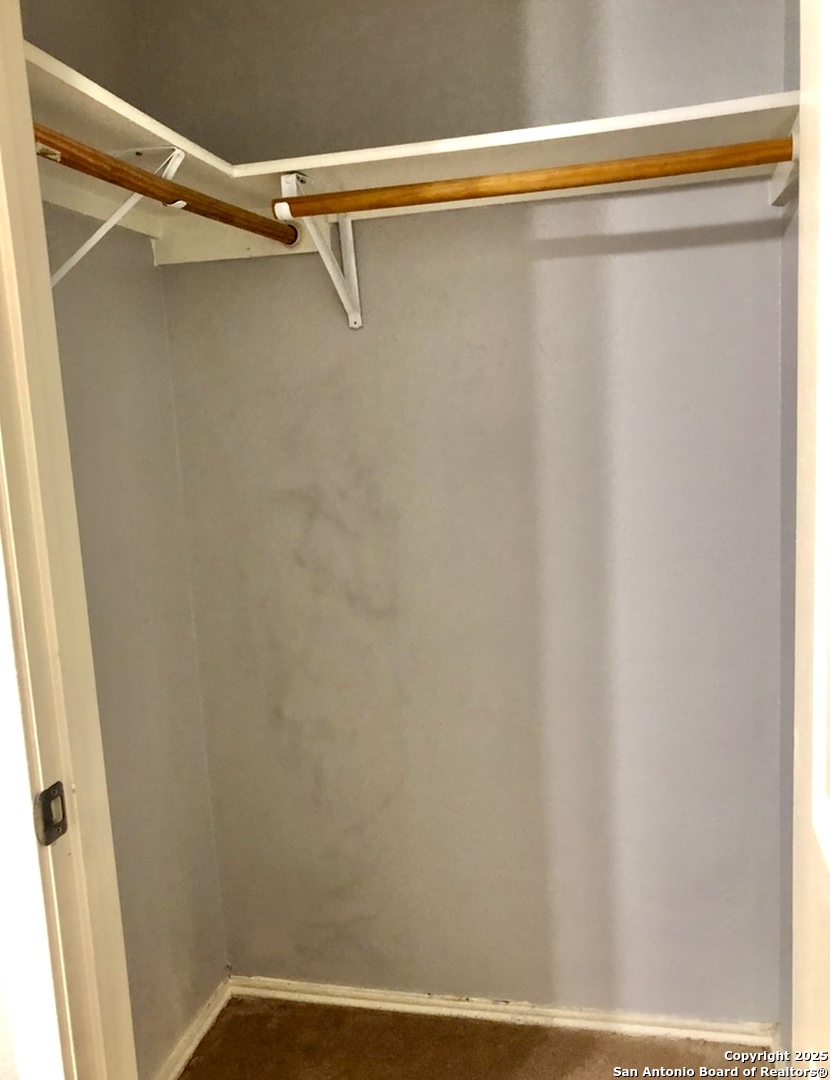 9135 Rue De Lis San Antonio, TX 78250 - Photo 19 of 23 a view of a room with racks on the wall