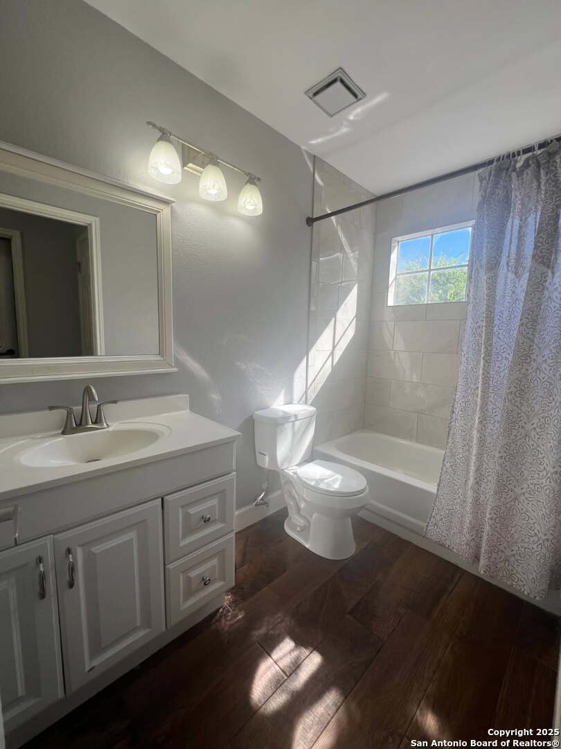 9135 Rue De Lis San Antonio, TX 78250 - Photo 21 of 23 a bathroom with a sink a toilet and a shower