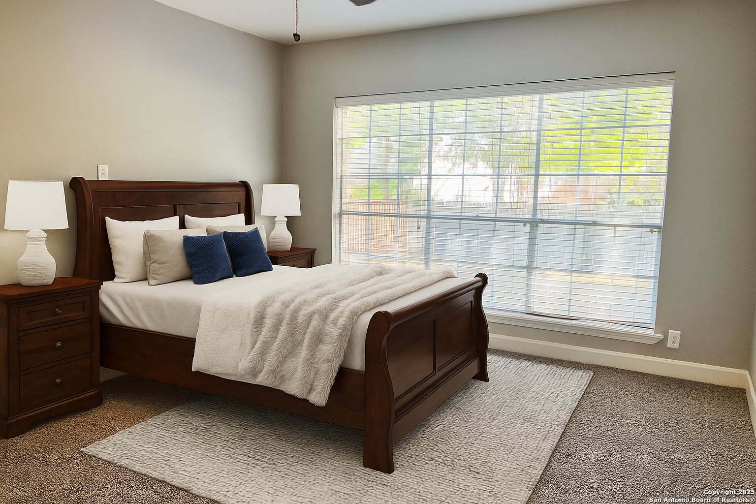 9135 Rue De Lis San Antonio, TX 78250 - Photo 5 of 23 a bedroom with a bed and large window