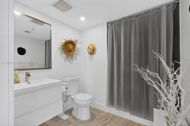 a view of a palm plant that is in front of a building