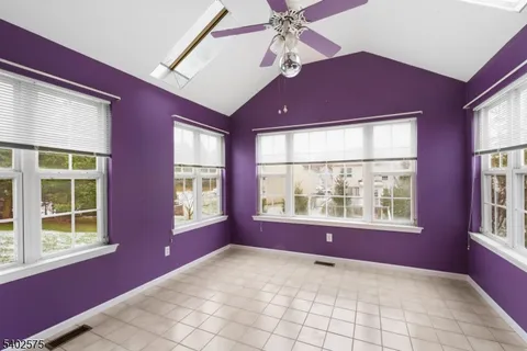 a view of an empty room with windows