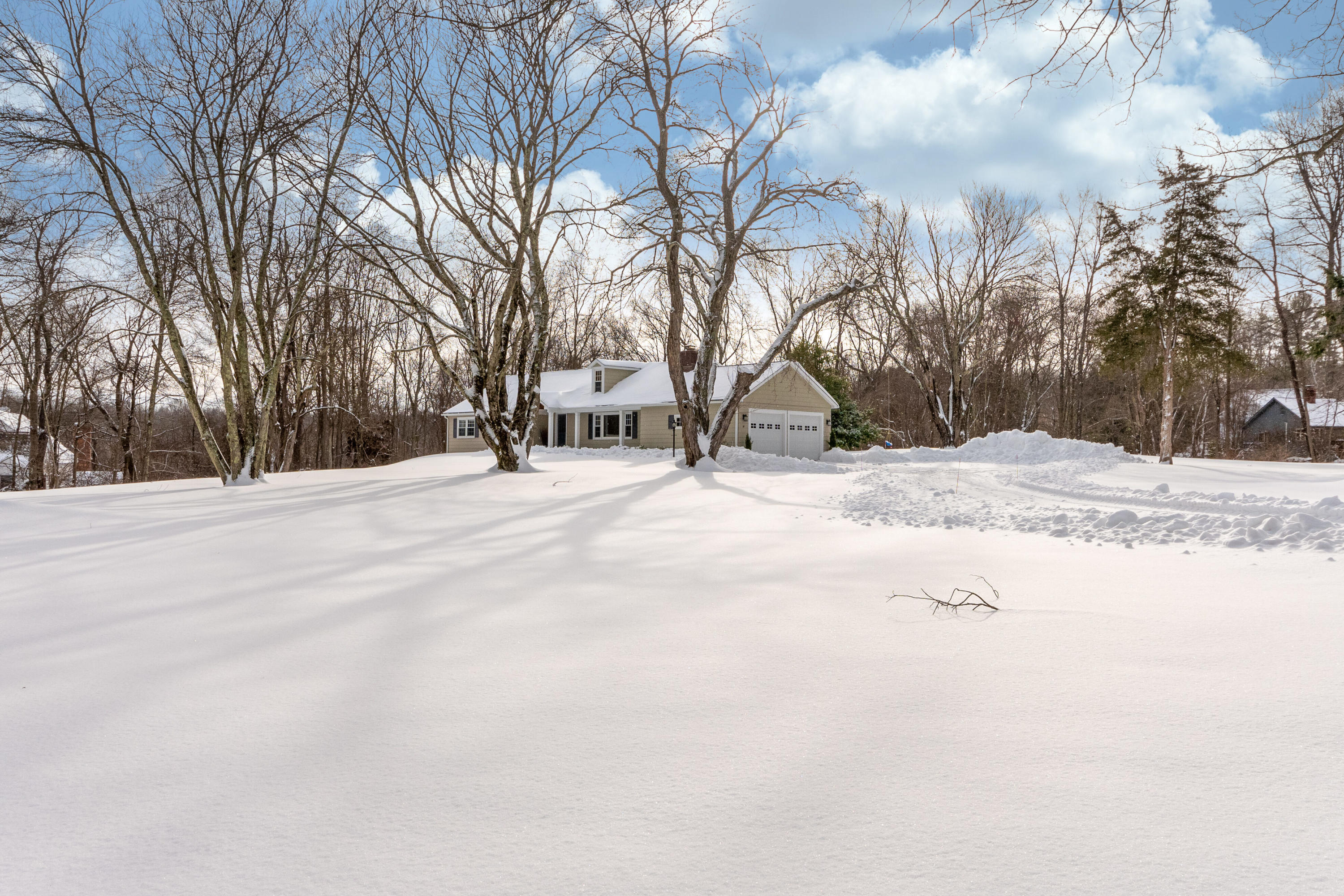 39 Scribner Hill Road Wilton, CT 06897 - Photo 1 of 25 a street view covered with snow