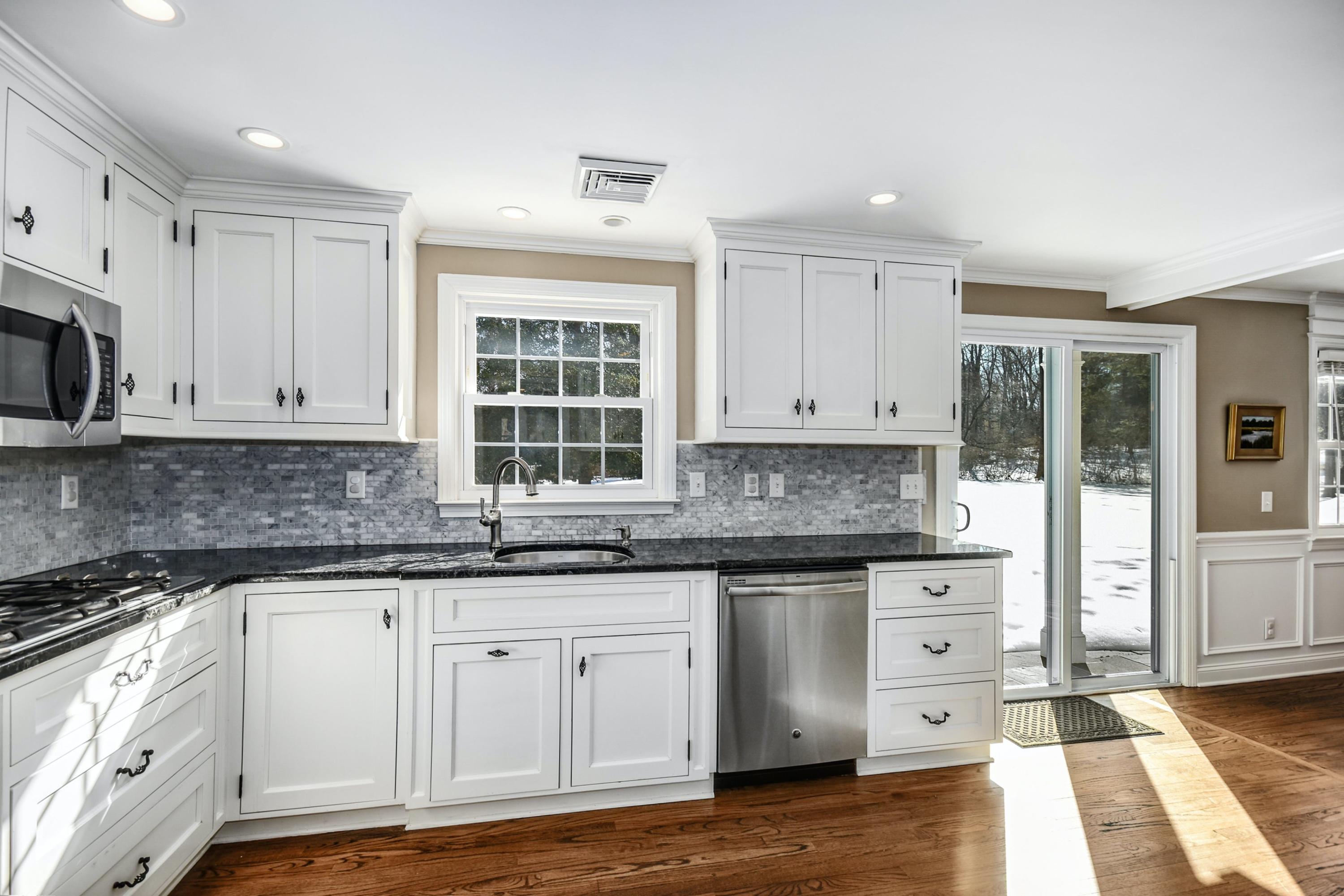 39 Scribner Hill Road Wilton, CT 06897 - Photo 11 of 25 a kitchen with granite countertop a sink and cabinets