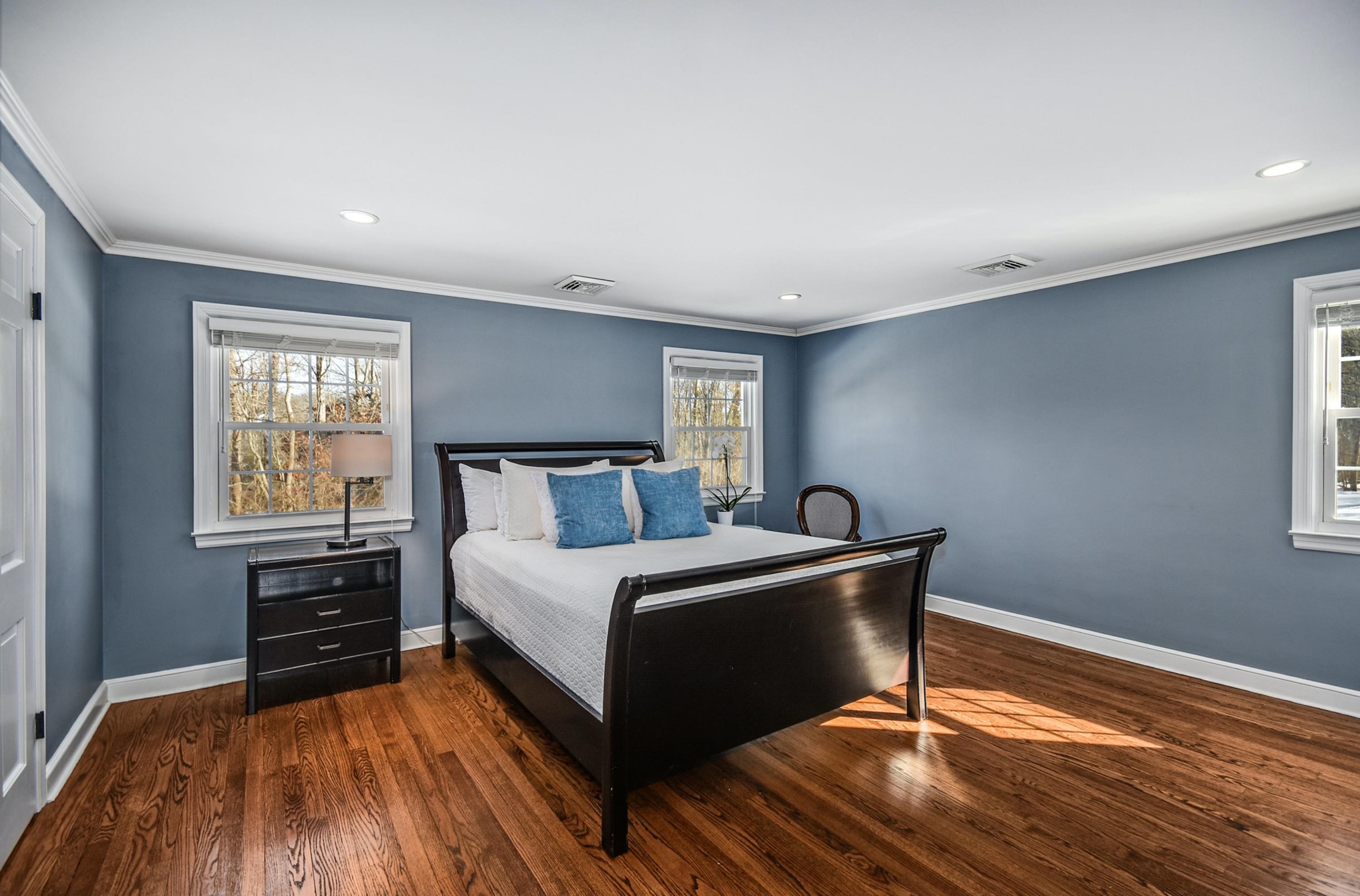 39 Scribner Hill Road Wilton, CT 06897 - Photo 12 of 25 a bedroom with a bed and a window