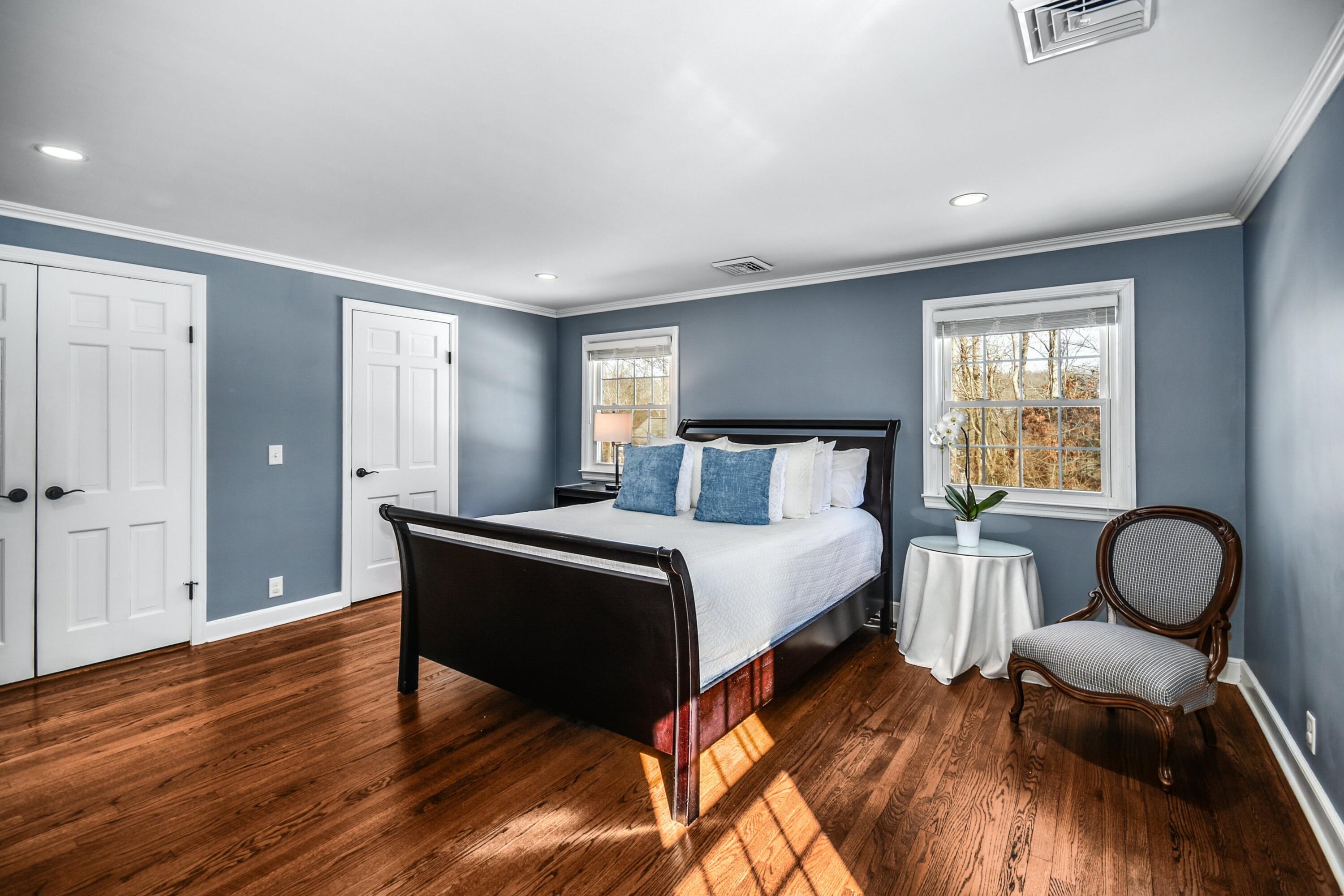39 Scribner Hill Road Wilton, CT 06897 - Photo 13 of 25 a bedroom with a bed mirror and a window