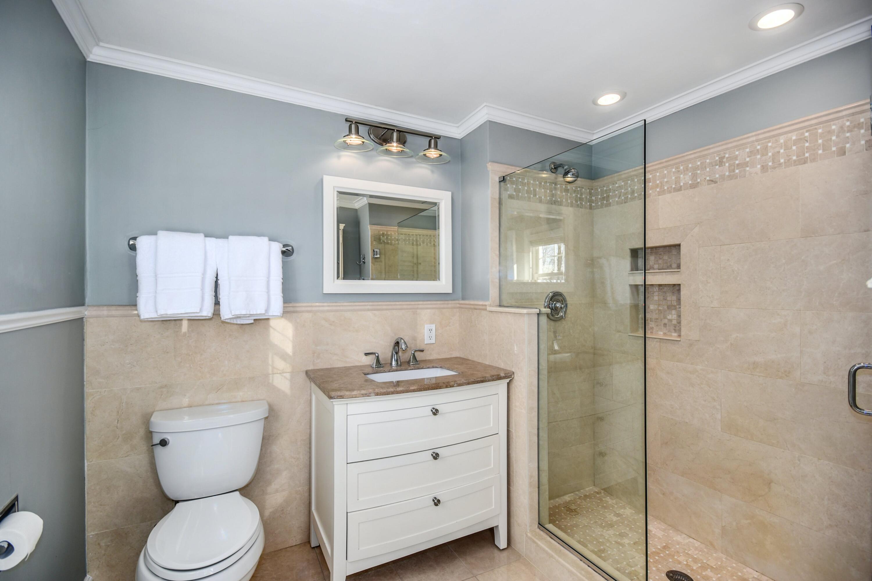 39 Scribner Hill Road Wilton, CT 06897 - Photo 14 of 25 a bathroom with a toilet sink and shower