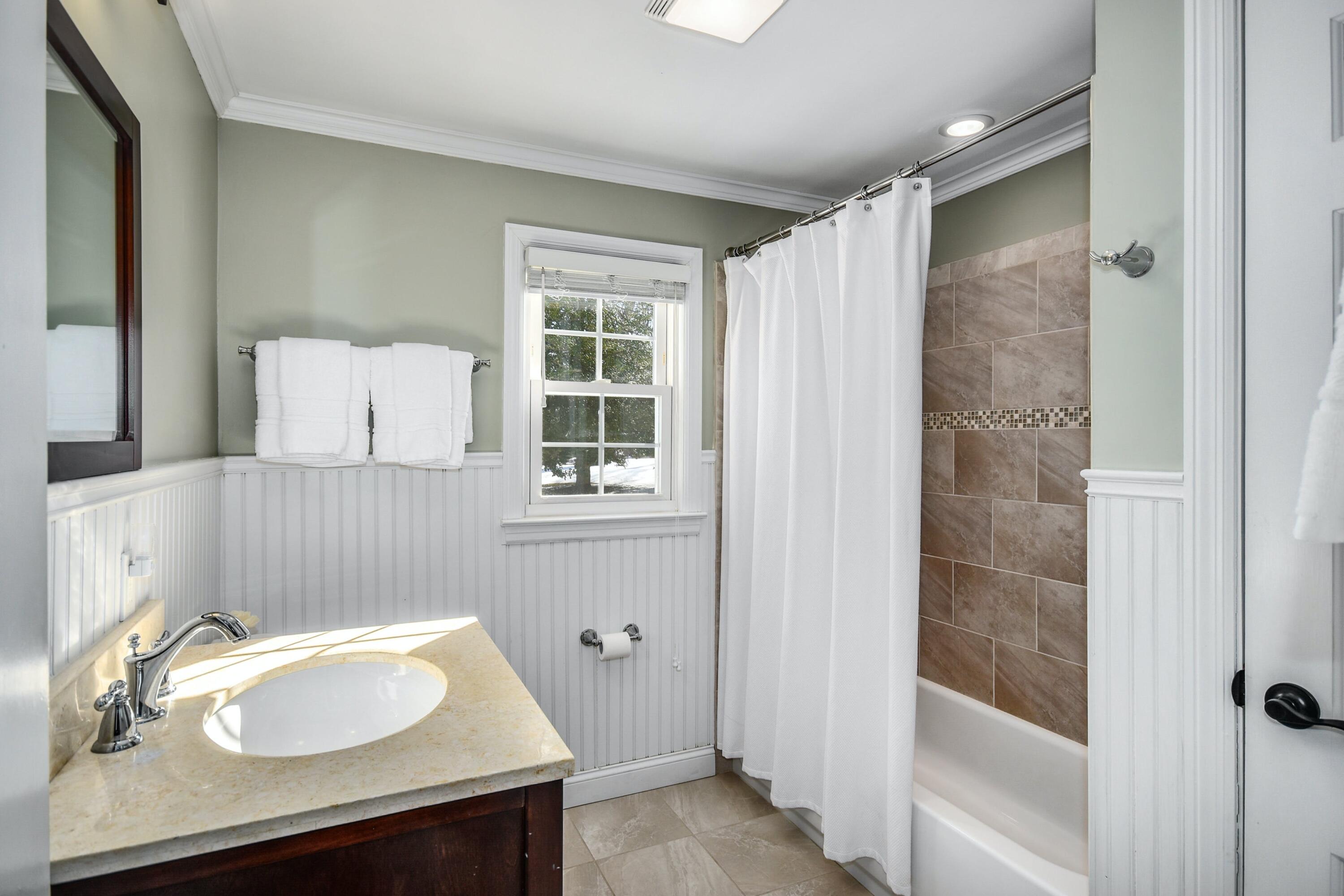 39 Scribner Hill Road Wilton, CT 06897 - Photo 17 of 25 a bathroom with a sink vanity granite tub and shower