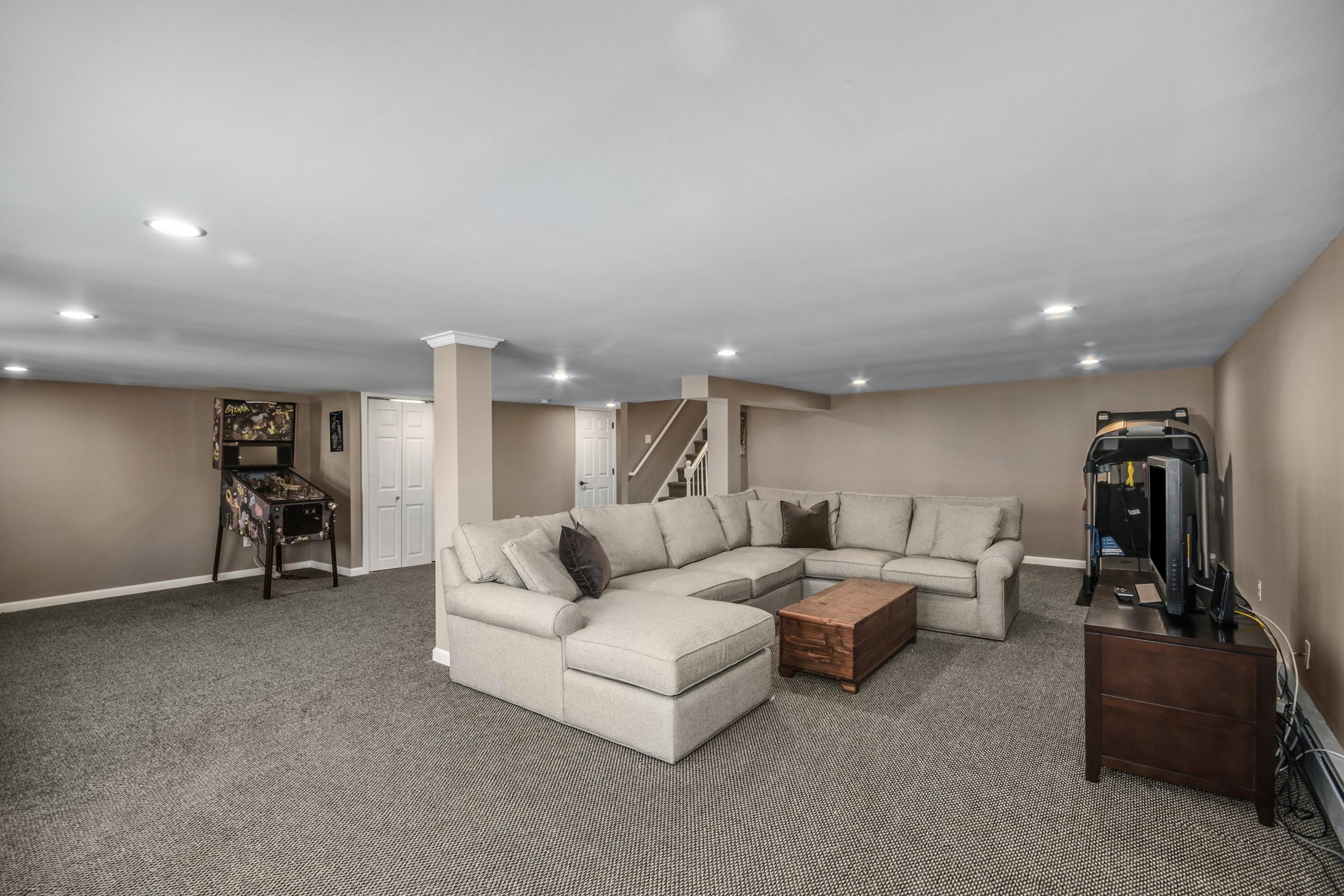 39 Scribner Hill Road Wilton, CT 06897 - Photo 18 of 25 a living room with furniture and gym equipment