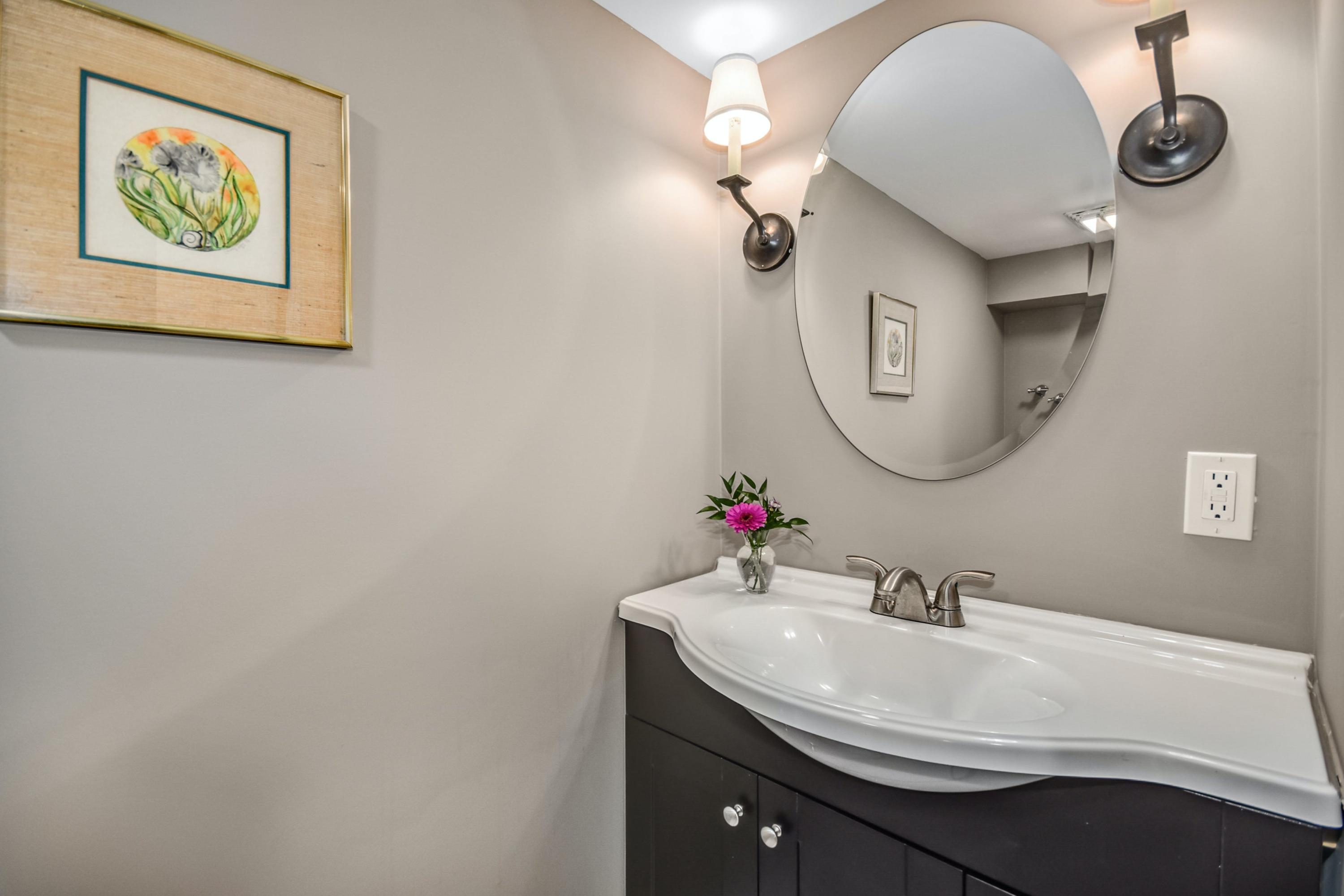 39 Scribner Hill Road Wilton, CT 06897 - Photo 21 of 25 a bathroom with a sink and a mirror