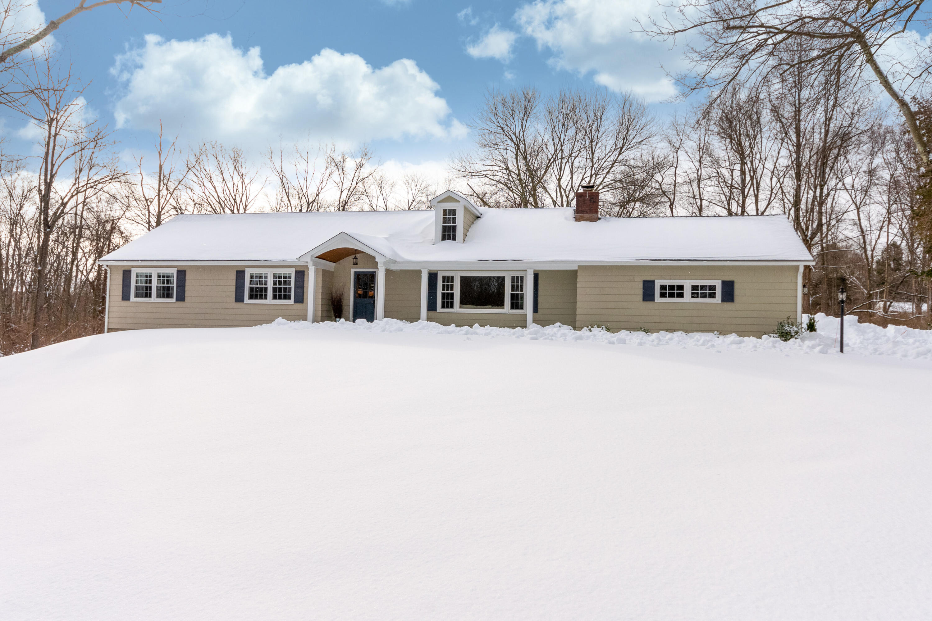 39 Scribner Hill Road Wilton, CT 06897 - Photo 23 of 25 a view of a white house with a large tree and a yard