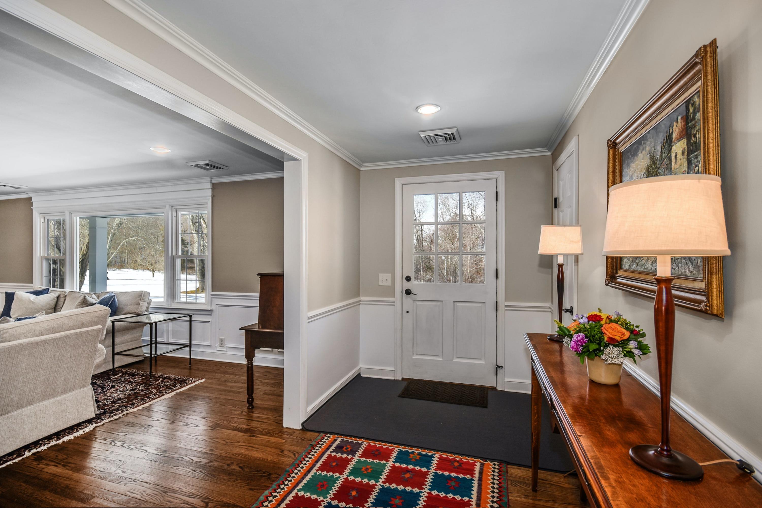 39 Scribner Hill Road Wilton, CT 06897 - Photo 4 of 25 a very nice looking room with wooden floor and furniture