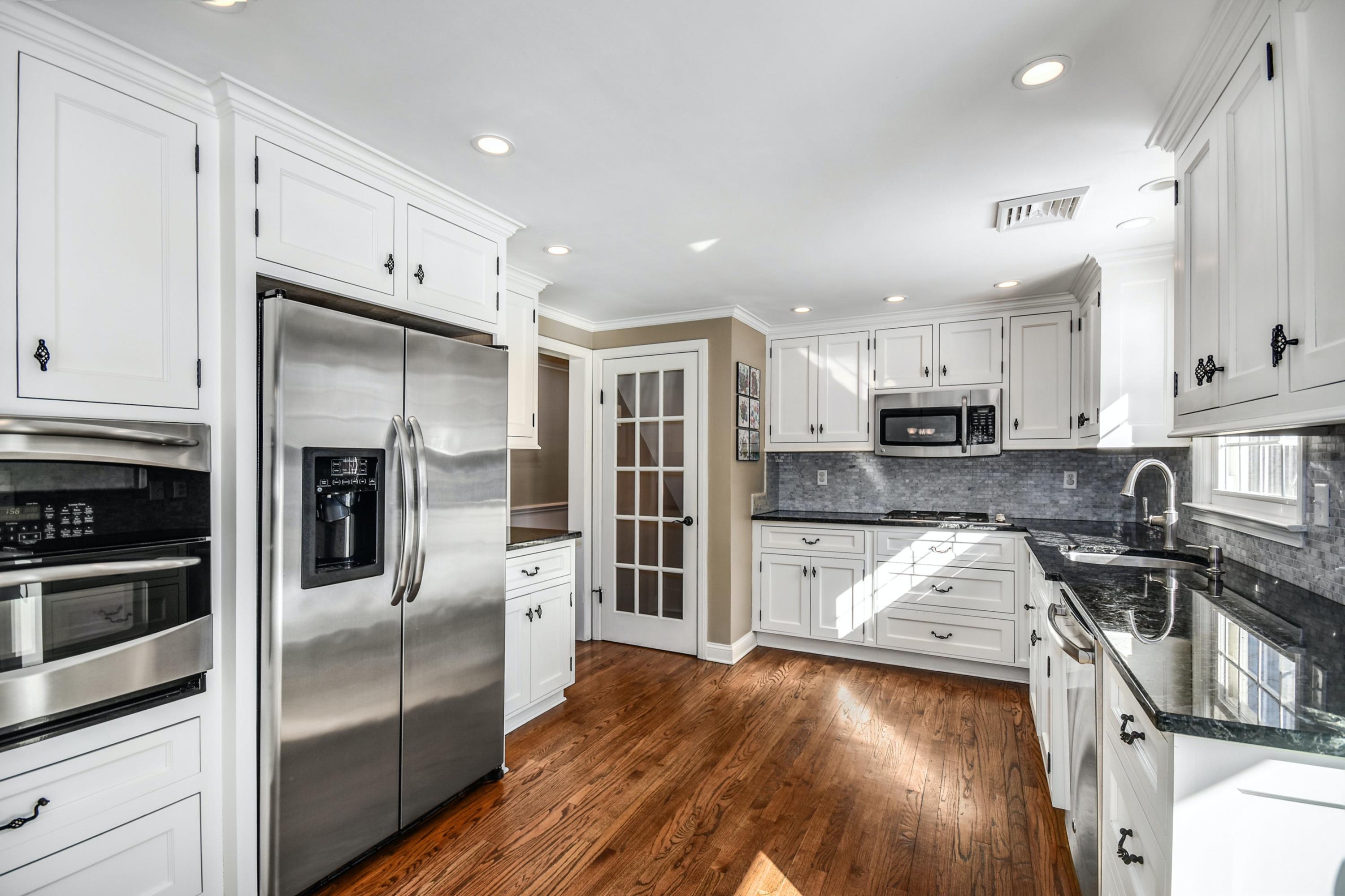 39 Scribner Hill Road Wilton, CT 06897 - Photo 10 of 25 a kitchen with stainless steel appliances granite countertop a refrigerator a stove and a sink
