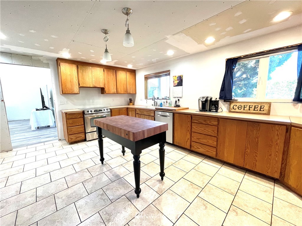 28 Dixon Road Omak, WA 98841 - Photo 13 of 39 a kitchen with stainless steel appliances a sink a counter top space and cabinets