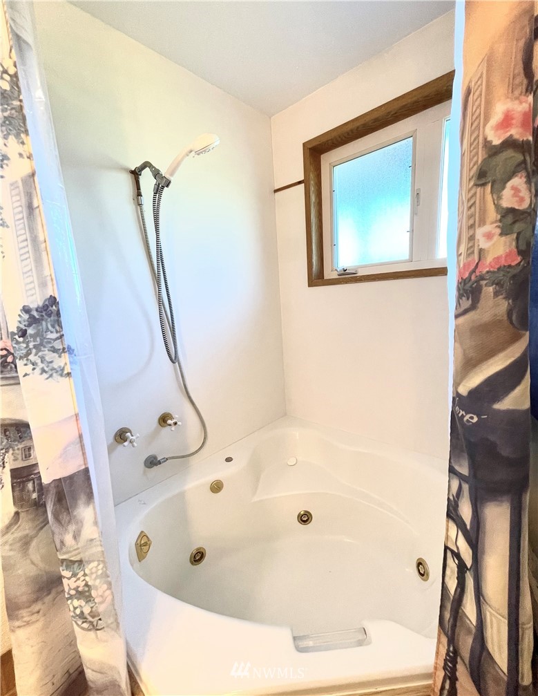 28 Dixon Road Omak, WA 98841 - Photo 27 of 39 a bathroom with a tub and shower