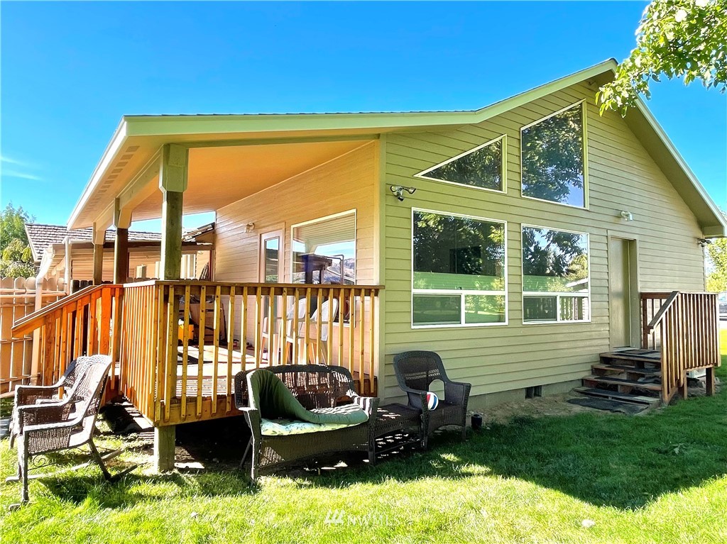 28 Dixon Road Omak, WA 98841 - Photo 4 of 39 a view of backyard with swimming pool and furniture