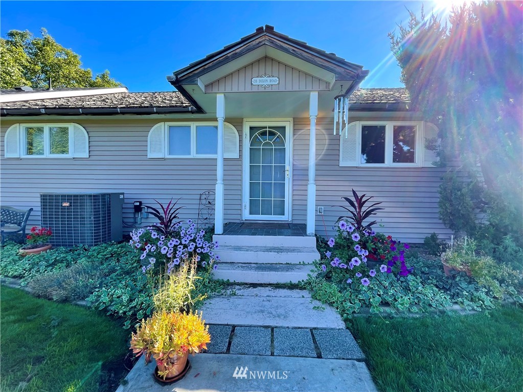 28 Dixon Road Omak, WA 98841 - Photo 7 of 39 a front view of a house with a yard