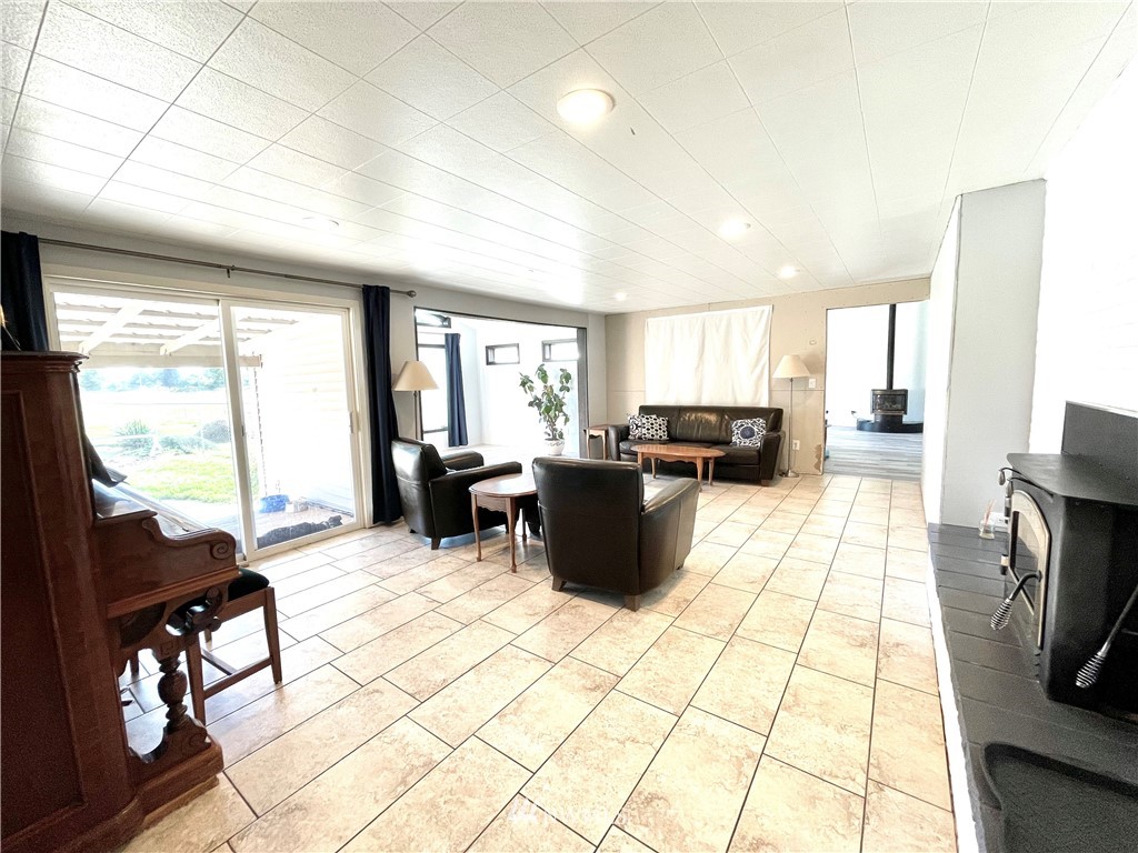 28 Dixon Road Omak, WA 98841 - Photo 9 of 39 a large living room with a large window